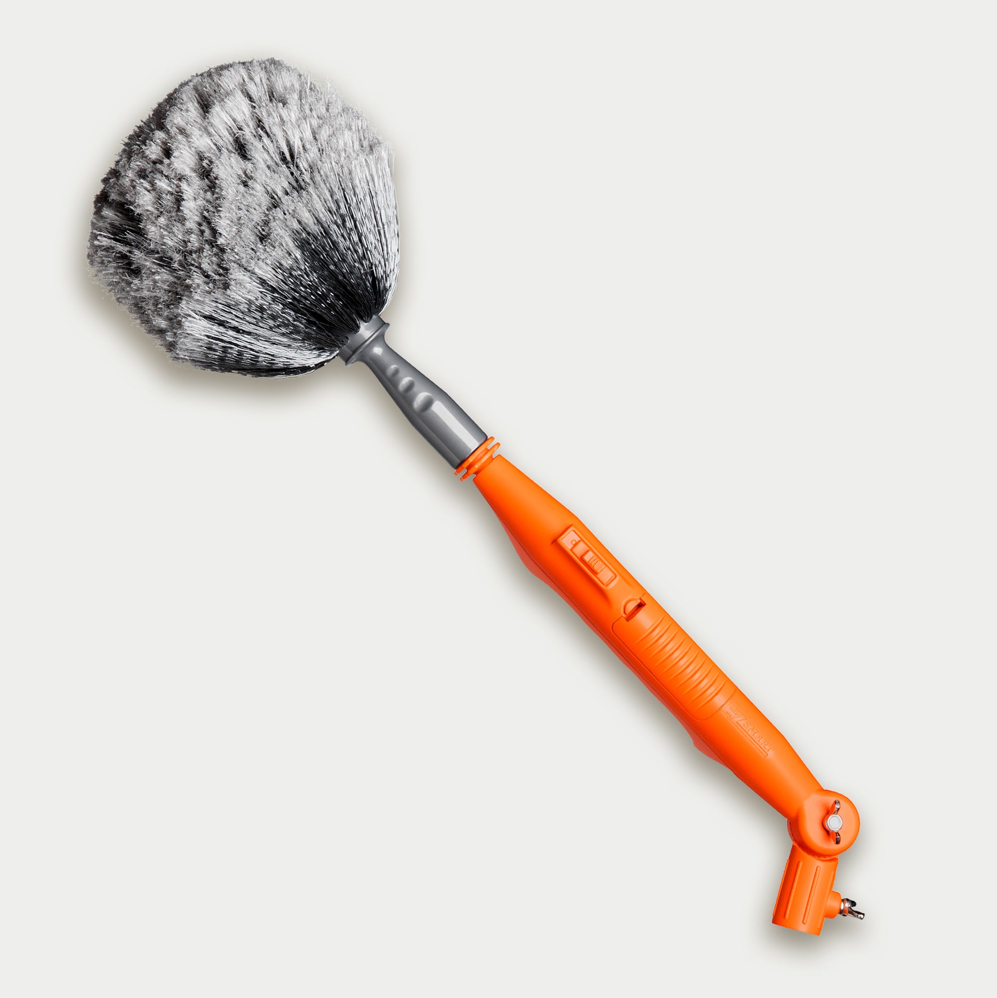 Cobweb duster that has a battery-operated motorized drive that rotates bristle head to remove debris