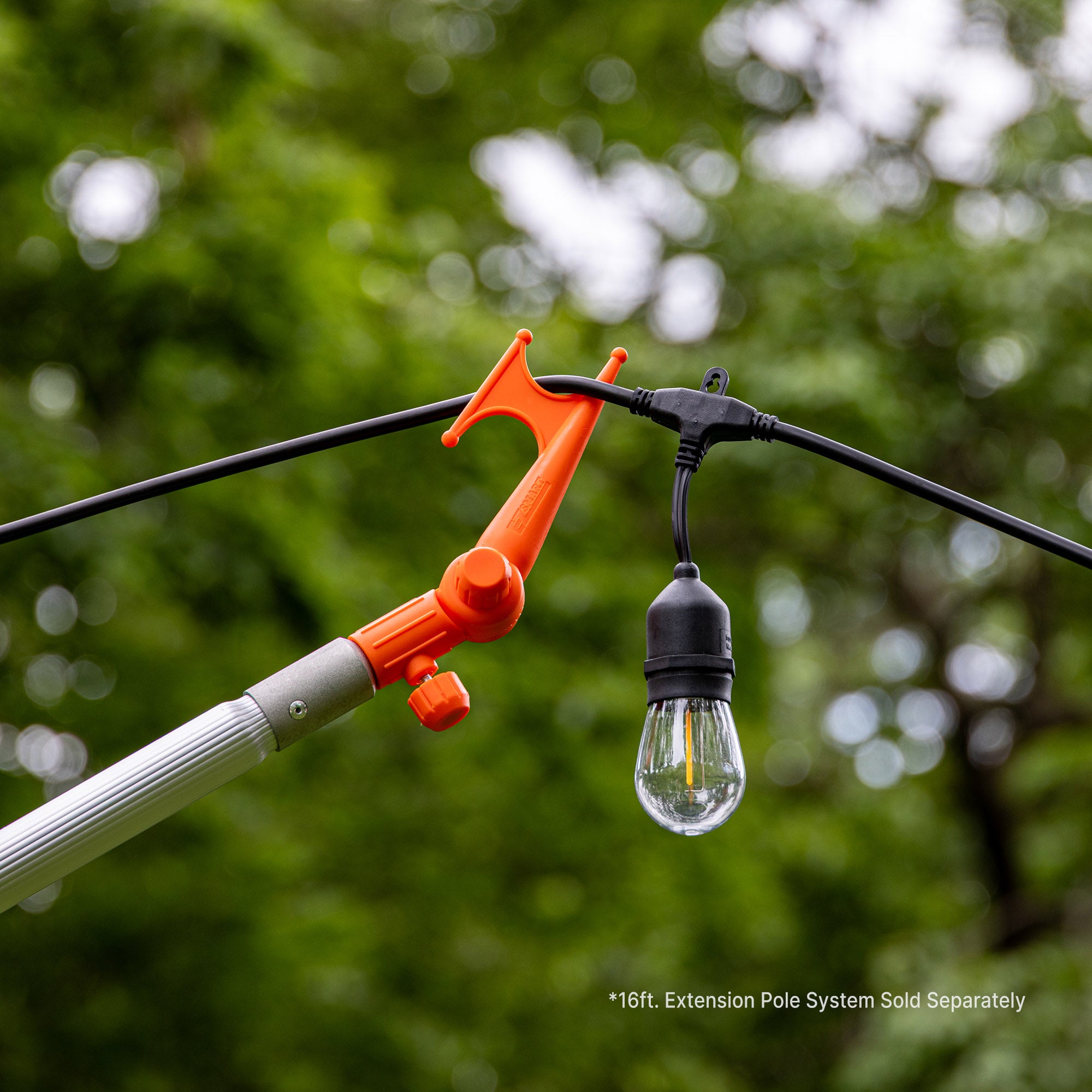 Handy Hook on extension pole hanging outdoor lights; EZ Smart extension pole kit sold separately.