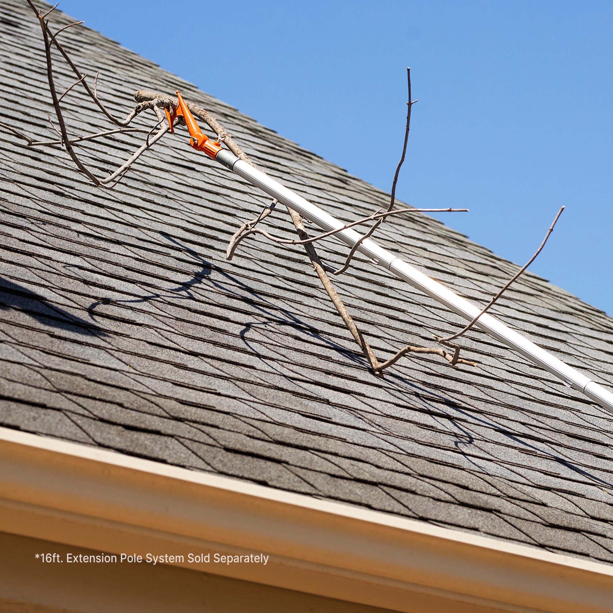 Handy Hook on extension pole removing debris from roof; EZ Smart extension pole kit sold separately.