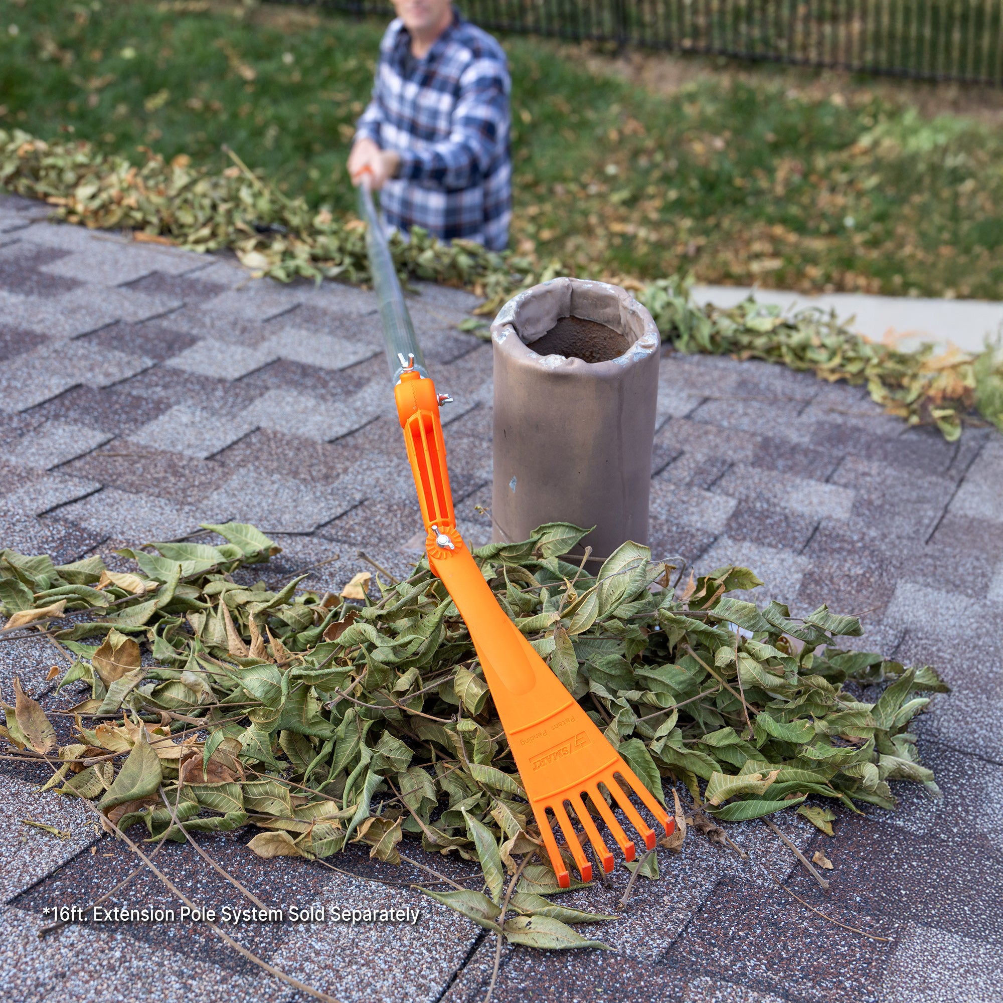 Man using EZ Smart Tools mini rake to clear leaves from roof; 16 ft extension pole sold separately.
